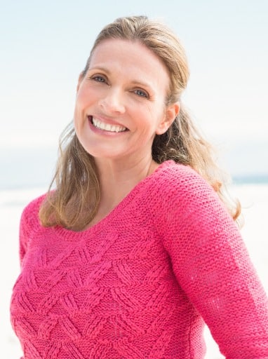 smiling woman wearing a lovely pink top picture id666692226 1