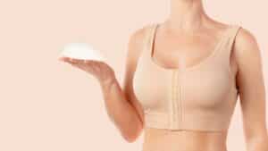 Woman holds implant in Lone Tree, CO