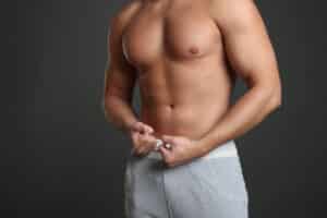Image of man's torso showing balanced chest after male breast reduction.