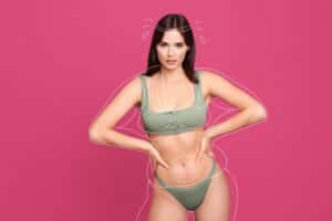 Woman with contour lines showing liposuction areas on abdomen, arms, and thighs