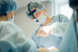 Plastic surgeons performing surgery