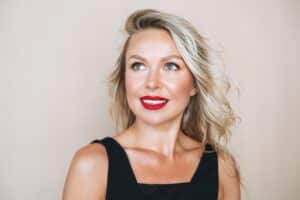 Woman with glowing skin and makeup before an event