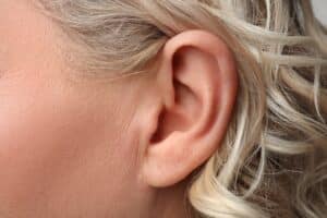 Close-up shot of a woman's ear after earlobe repair in Lone Tree